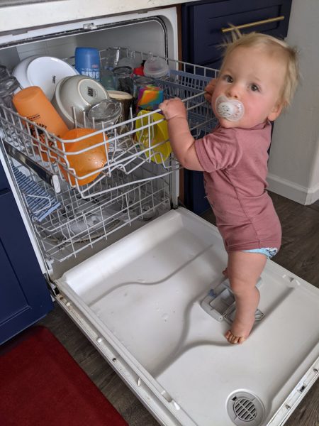 Helping unload the dishwasher